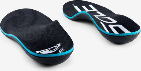 Two blue and black shoe inserts, one showing the top with black cloth, the other showing the bottom with the word SOLE in large white letters.