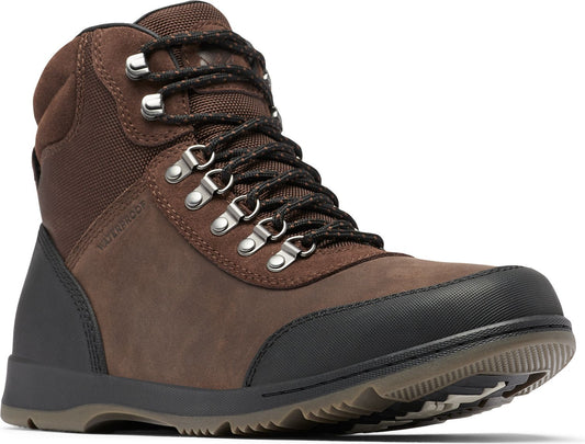 Brown leather and fabric boot with black sole and metal eyelets.