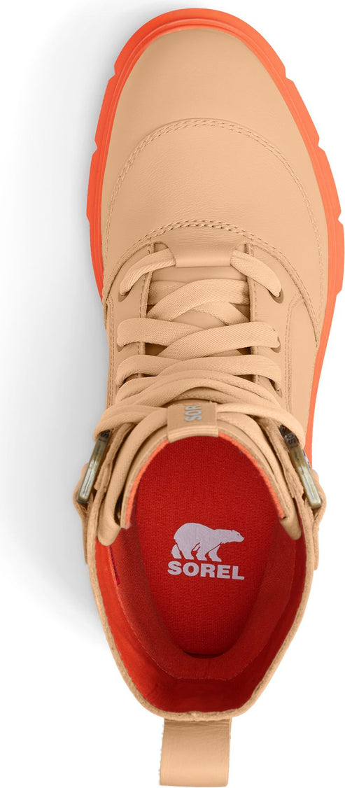 Top-down view of a tan boot with orange soles and a red insole featuring the SOREL logo.
