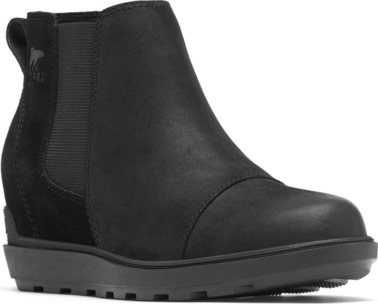 Black ankle boot with elastic sides and wedge platform.