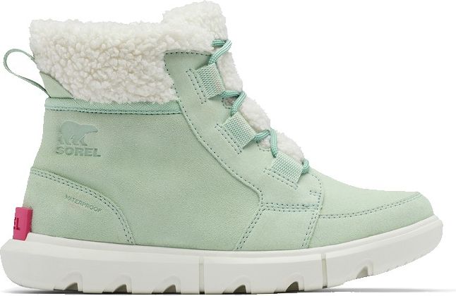 Mint green ankle boot with white sherpa lining, lace-up, visible "SOREL" logo, and pink detail at heel.