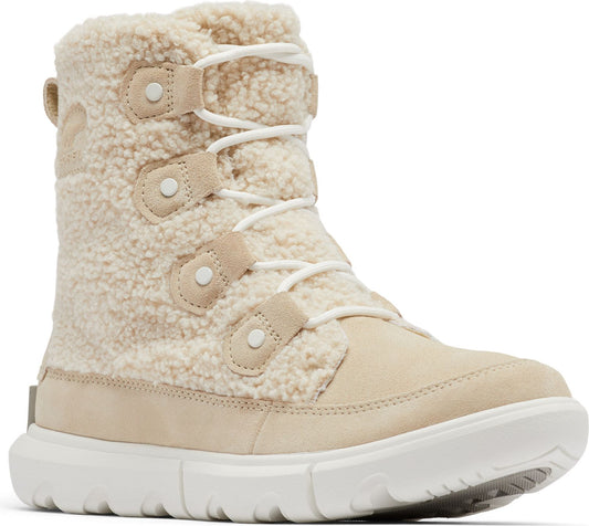 Beige shearling snow boot with suede details and white laces.