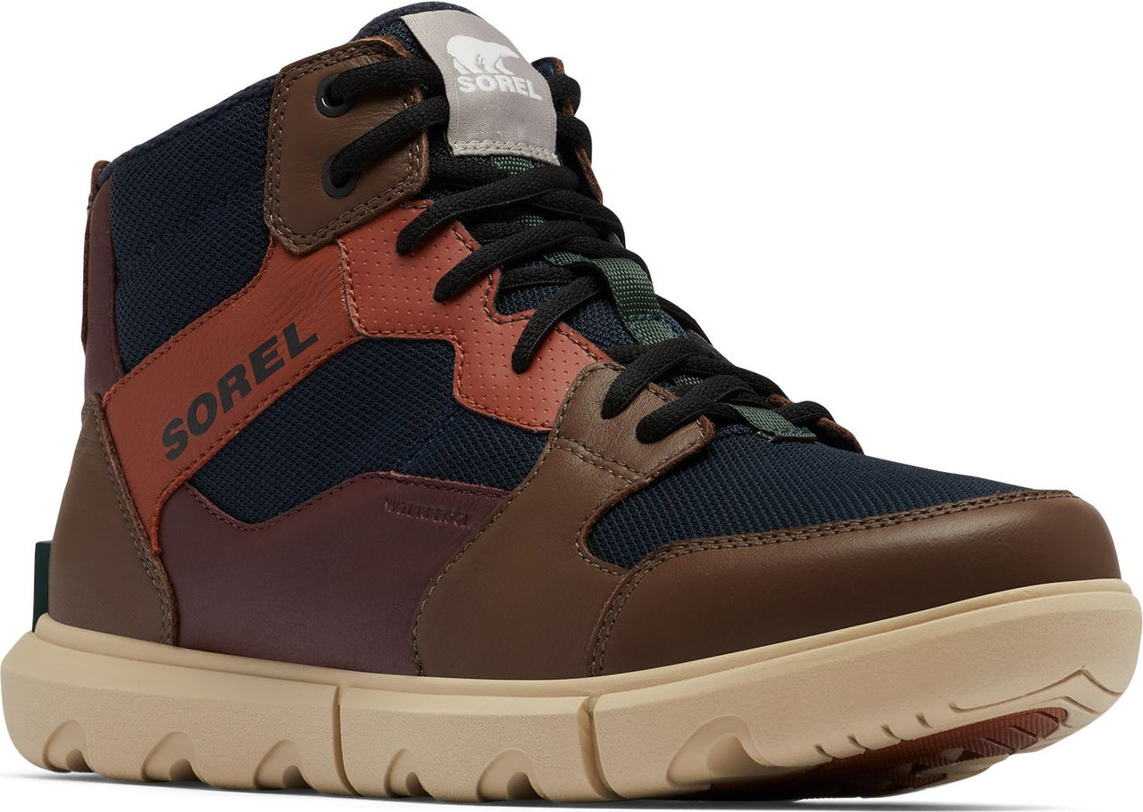 High top boot with navy, red, and brown leather trim and the word SOREL on the side.