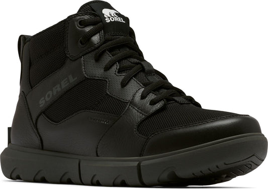 A black, mid-height boot with a rubber sole and a logo on the upper tongue.