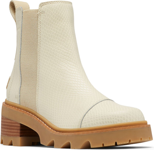 Beige ankle boot with tan elastic side panels, pull tab, treaded sole and block heel.
