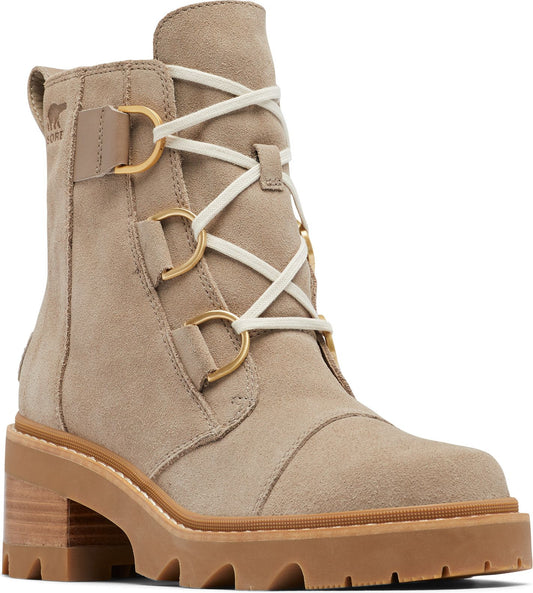 Tan suede ankle boot with a thick lug sole, block heel, lace-up closure, and decorative gold hardware.