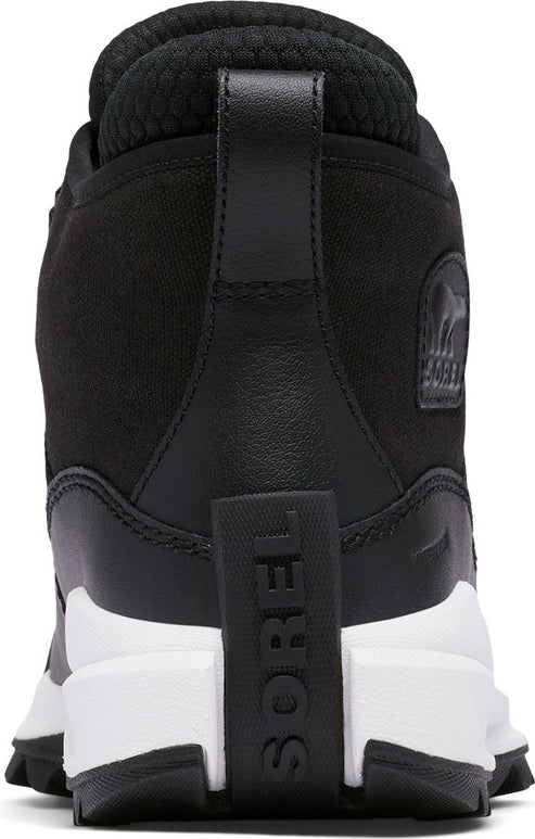 Rear view of a black boot with a thick white sole and "SOREL" text vertically across the heel.