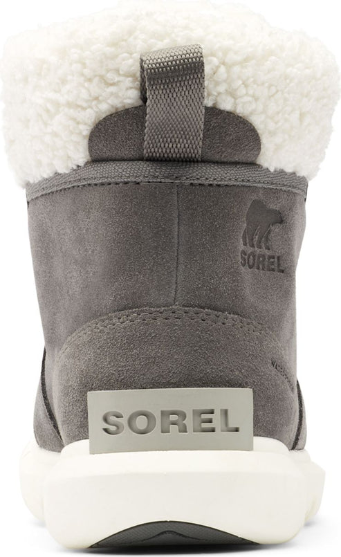 Rear view of a gray suede boot with white trim and white sole. "SOREL" is embossed on the heel in gray and white.