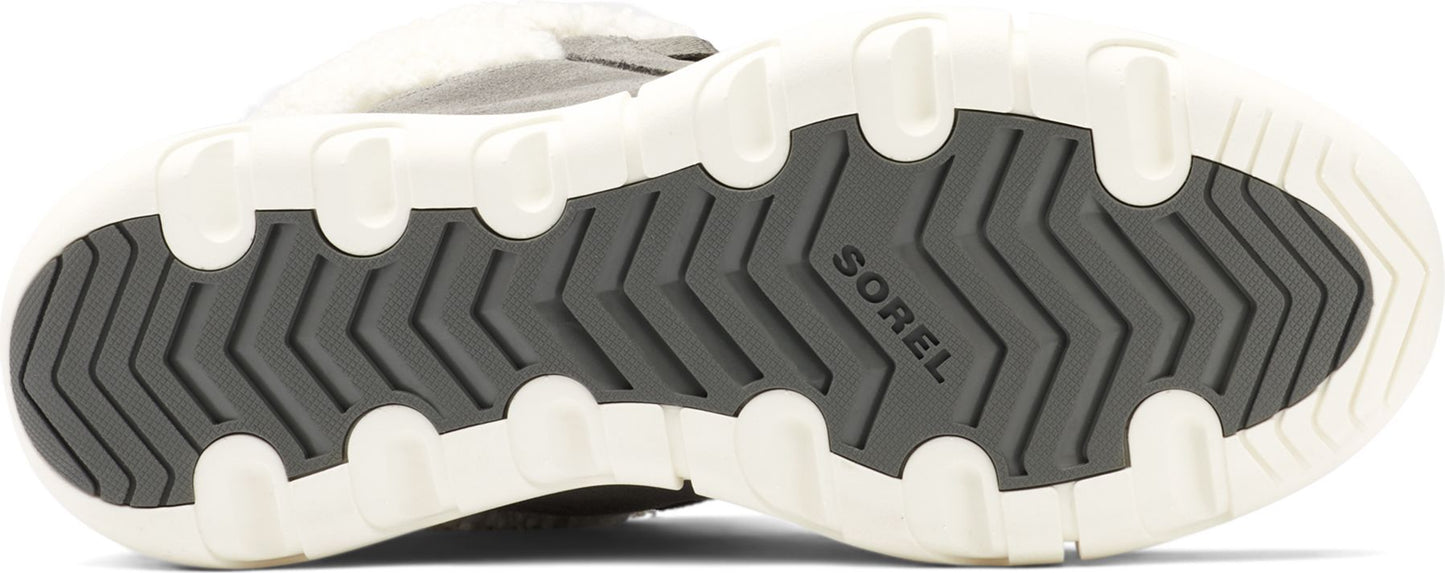 The shoe's sole is white with gray rubber treads. The word "SOREL" is visible on the tread.