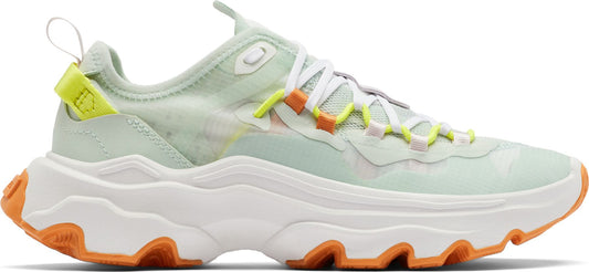 A women's white and green sneaker with an orange sole.
