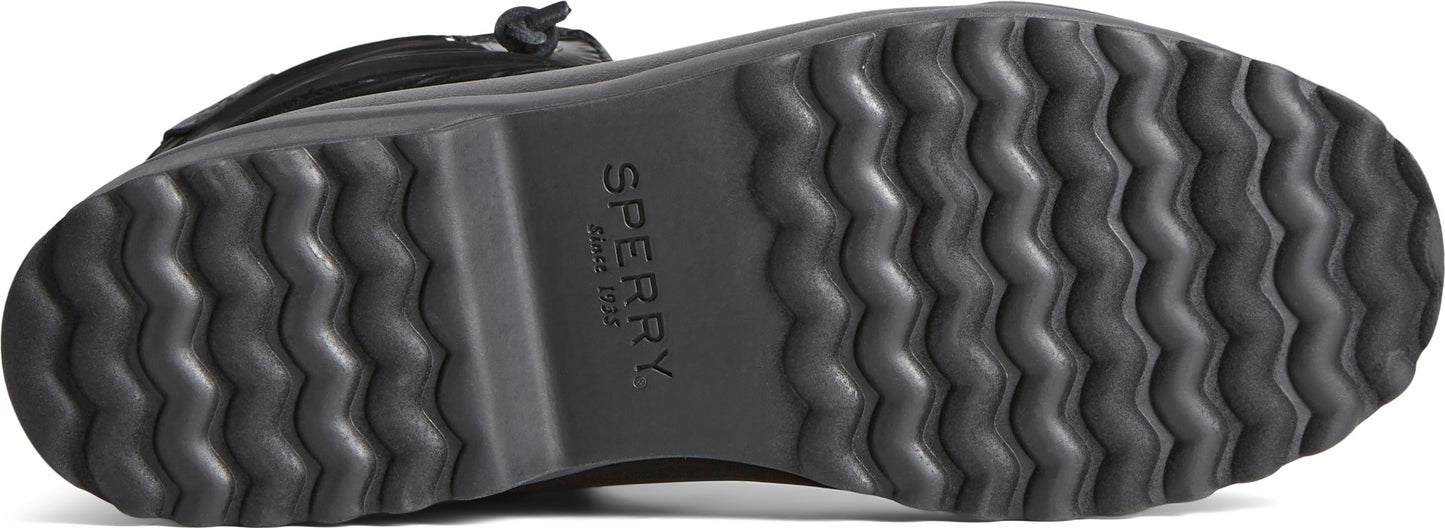 Close-up of a shoe sole with deep, wavy treads and 'SPERRY' text in the center.