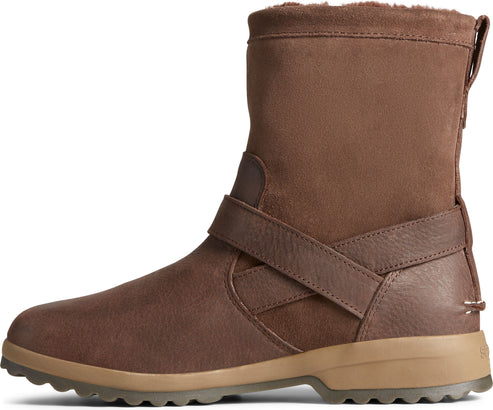 Brown, short, waterproof boot with suede uppers, faux-fur lining, and a brown cross strap.