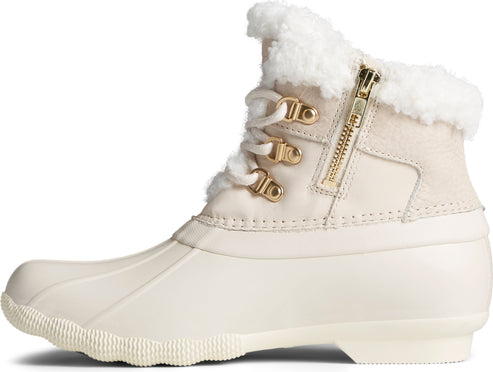Side view of off-white duck boot with white laces and gold hardware, fur lining visible at the top.