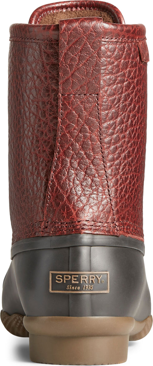 Rear view of a high-top boot with red textured leather upper and a dark gray rubber bottom.