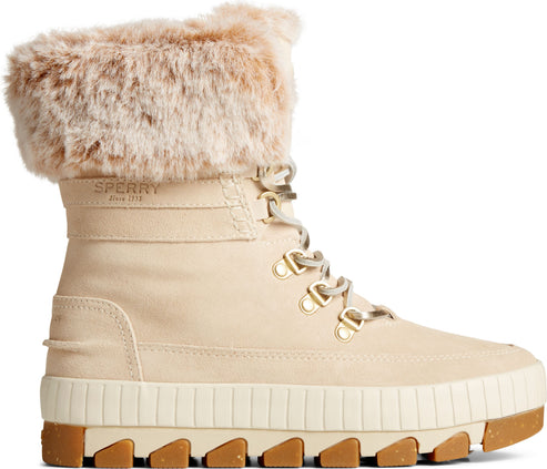 Beige ankle boot with a platform sole, lace-up closure with metallic eyelets, and a faux fur-lined upper.
