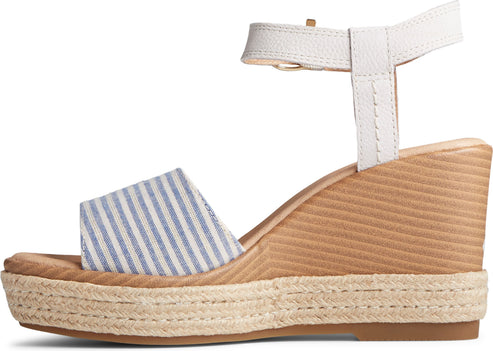 Striped wedge sandal with ankle strap and jute platform.