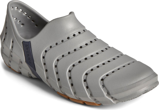 Gray boat shoe with perforated horizontal bands and a small navy blue patch.