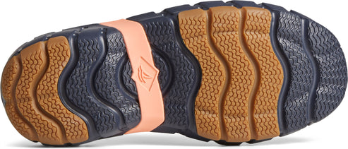 sole of a shoe showing wavy pattern in brown and navy with a coral pink logo strap