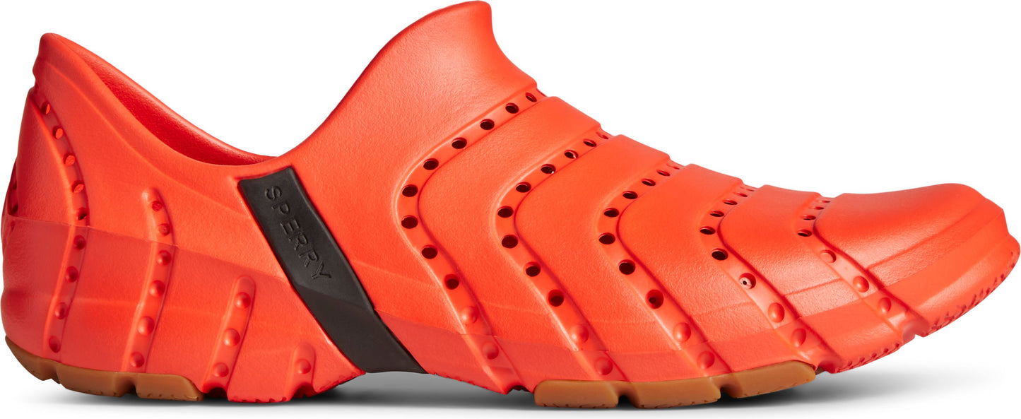 Orange slip-on shoe with segmented, perforated upper and brown sole.