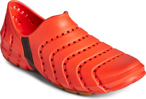 Orange slip-on shoe with horizontal slits and holes.