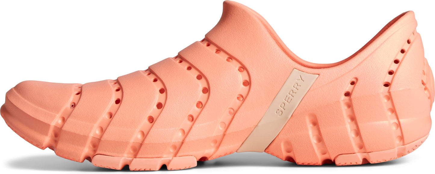 Salmon-colored perforated slip-on shoe with a tan logo.