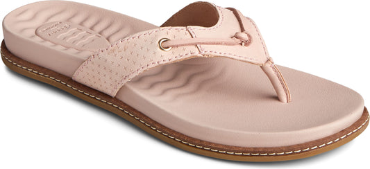 A close-up of a pink flip-flop sandal with a brown sole.