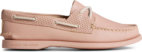 Pink boat shoe with perforations.
