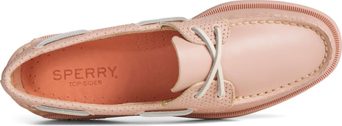 A pink boat shoe with white laces.