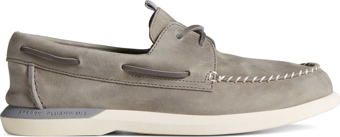 A gray moccasin-style shoe with a white sole.
