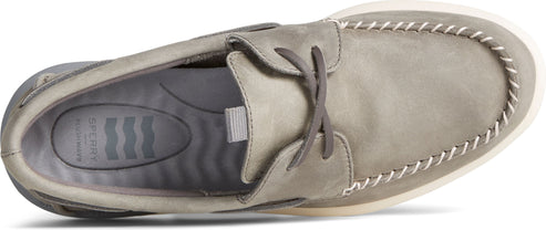 A top-down view of a boat shoe featuring gray leather and contrasting white stitching.