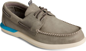 Grey leather boat shoe with brown laces and blue heel accent.