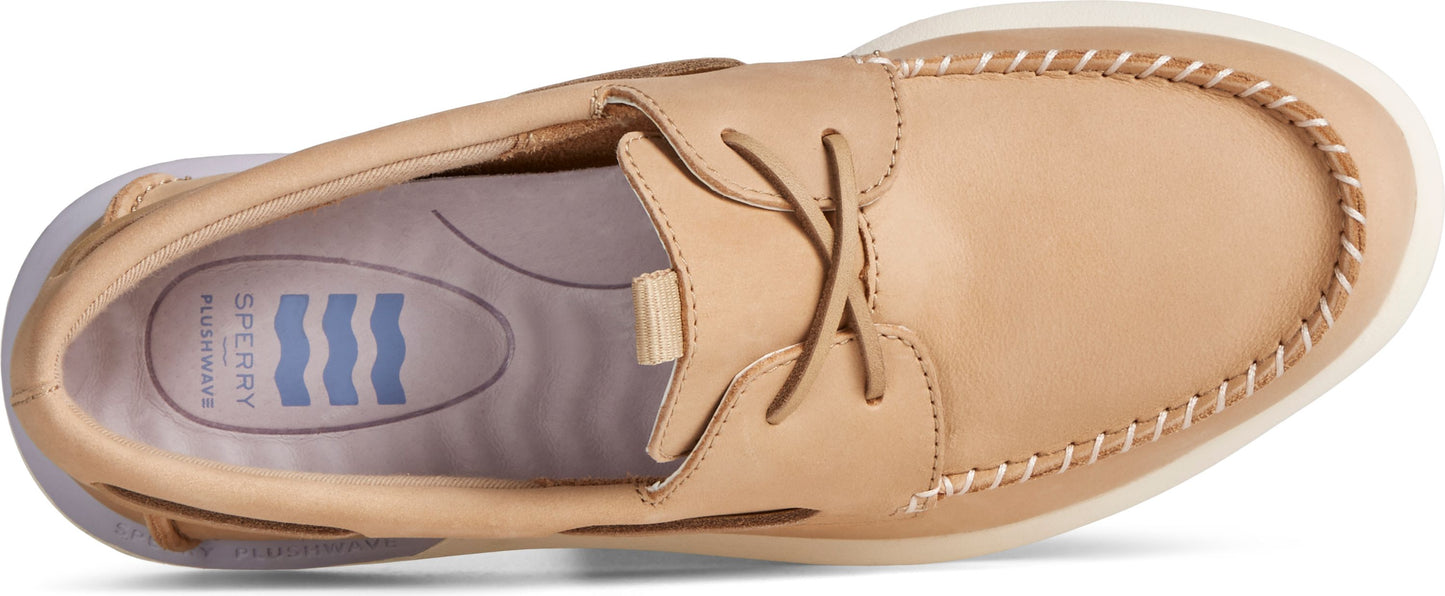 Tan boat shoe with white stitching.