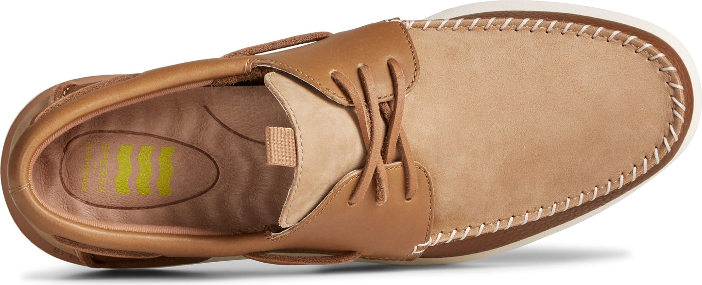 Tan leather boat shoe with contrasting stitching and laces.