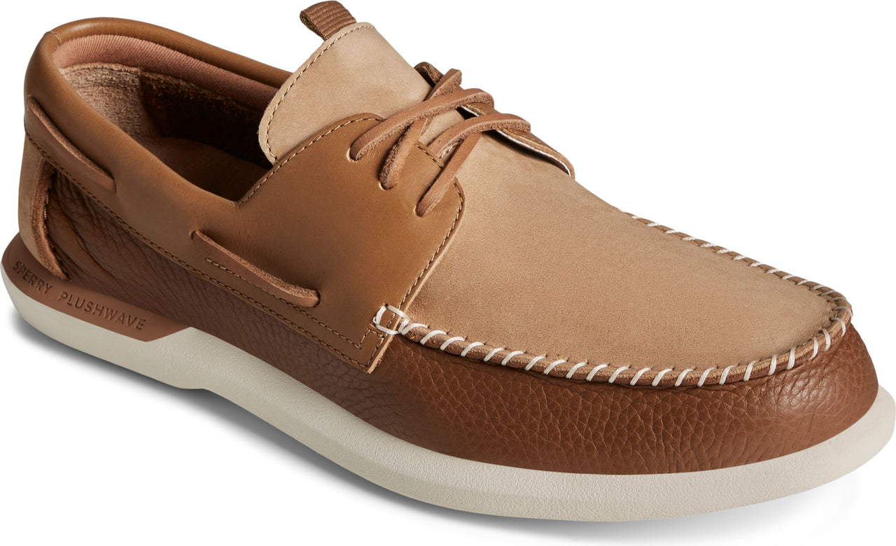 Brown boat shoe with light brown top and white sole.