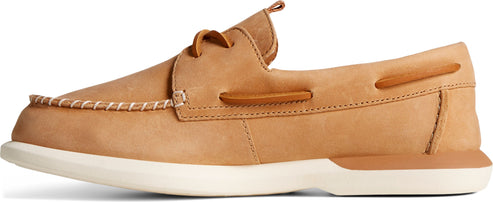 A tan, leather boat shoe with white laces and a white sole.