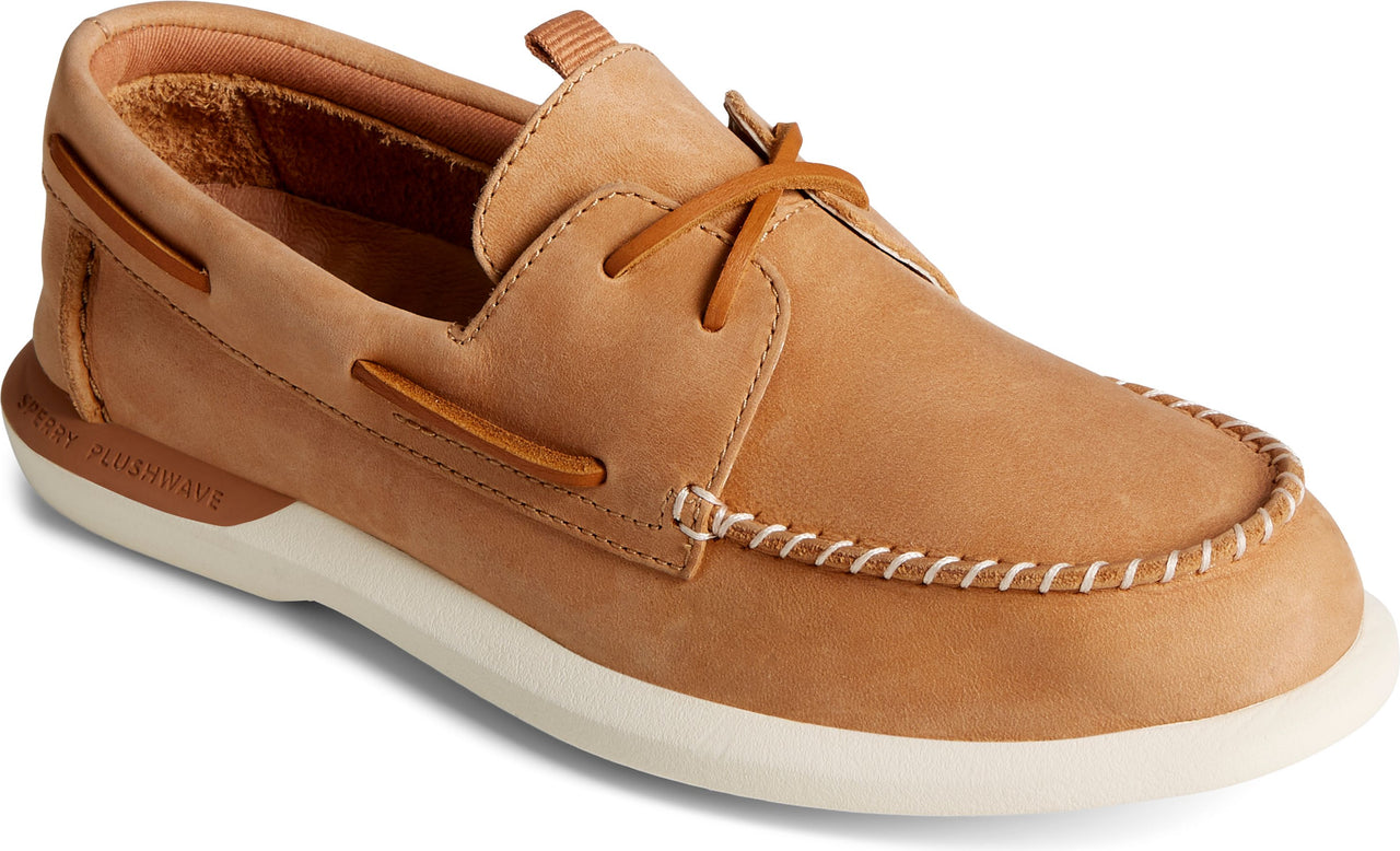 Tan leather boat shoe with a white sole.