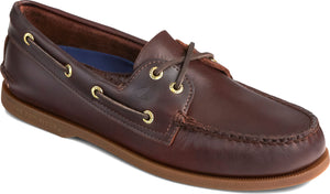 Brown leather boat shoe with gold eyelets and a gum sole.