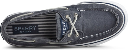 Top-down view of a boat shoe in a denim-like fabric with white laces and a white sole.