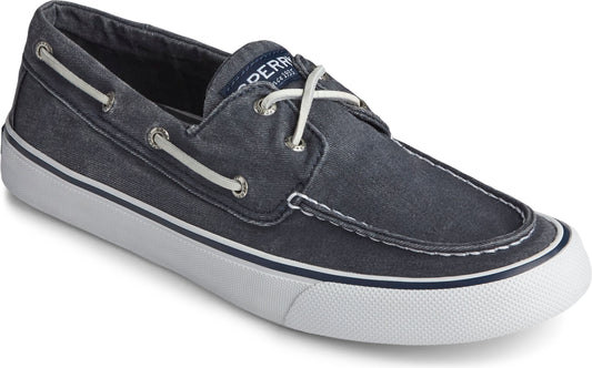 Navy blue canvas boat shoe with white laces and sole.