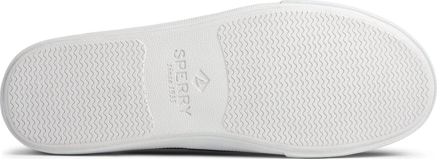 White shoe sole with subtle wave pattern and Sperry logo.