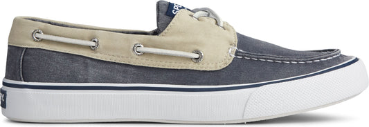 A low-profile, blue boat shoe with cream colored accents.