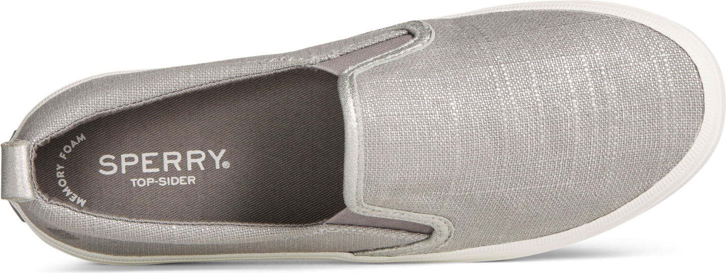 A silver slip-on shoe with a white sole.