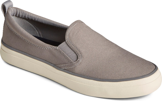 Slip on grey sneaker with elastic panels and a thick white sole.