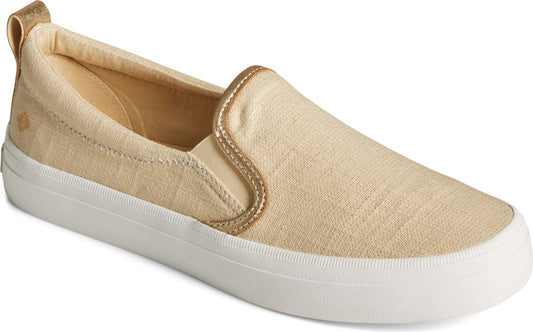 Beige canvas slip-on shoe with white sole and gold trim.