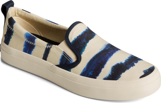Beige slip-on shoe with blue zebra print, rounded toe, and rubber sole.