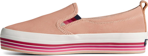 Salmon-colored slip-on shoe with a thick platform sole featuring pink stripes.