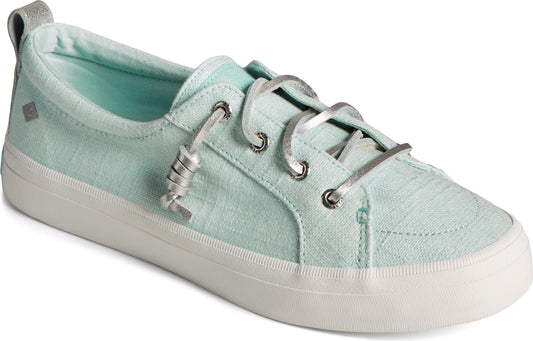 Seafoam green canvas sneaker with white sole and silver laces.