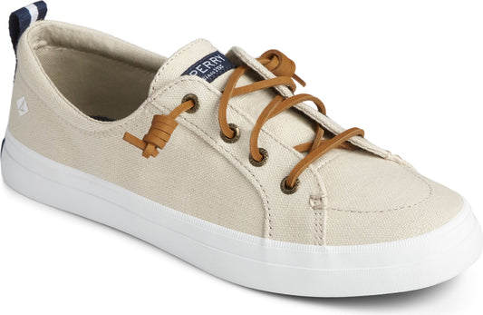 Beige canvas sneaker with brown laces and a white sole.