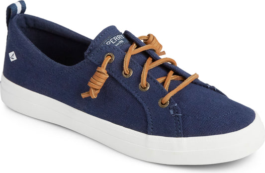 Navy boat shoe with brown laces and white soles.