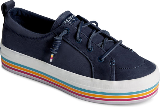 Navy sneaker with a thick white sole striped with orange, turquoise, and magenta.